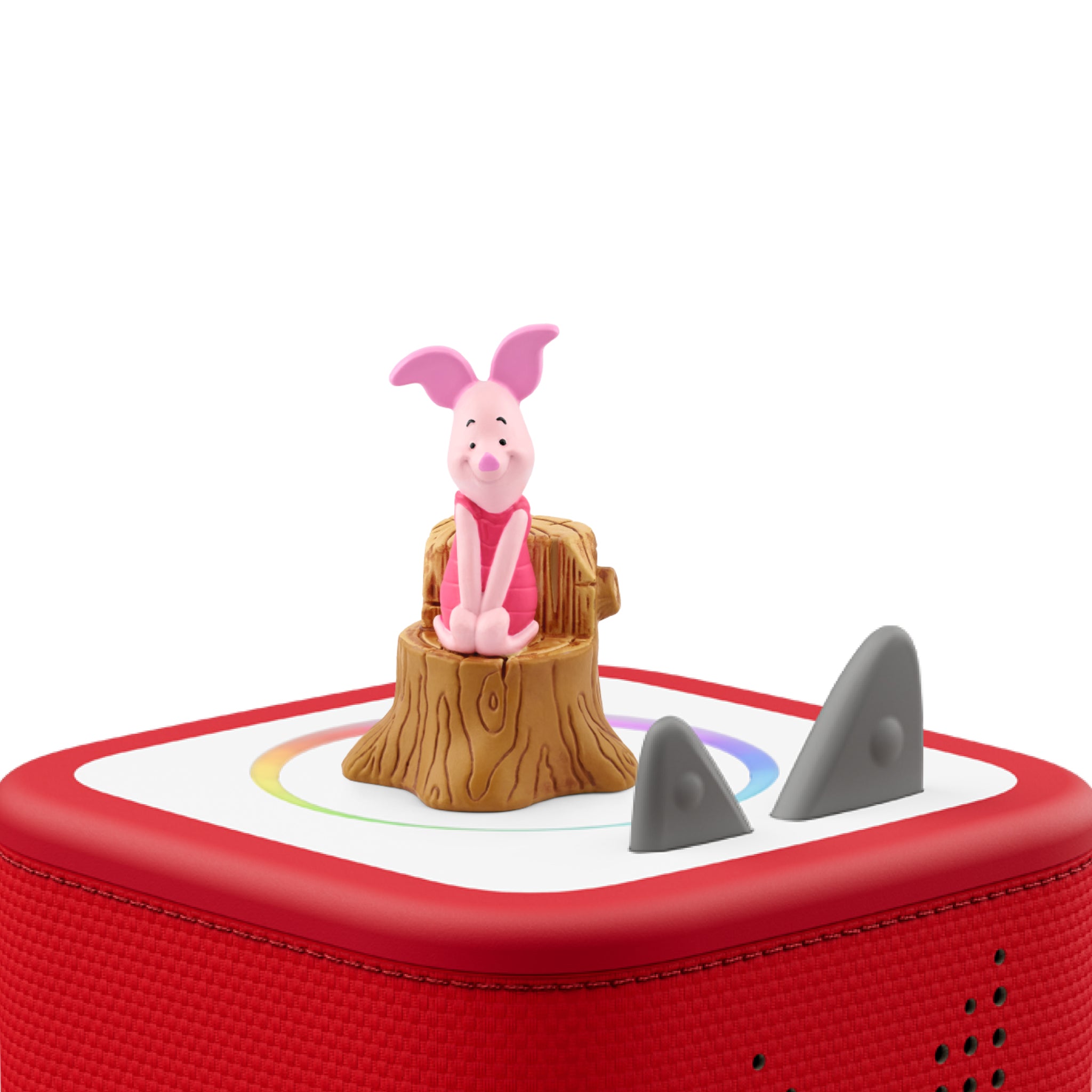 Red toy with a pig figurine on a white background