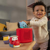Child playing with toys on a table in a living room setting