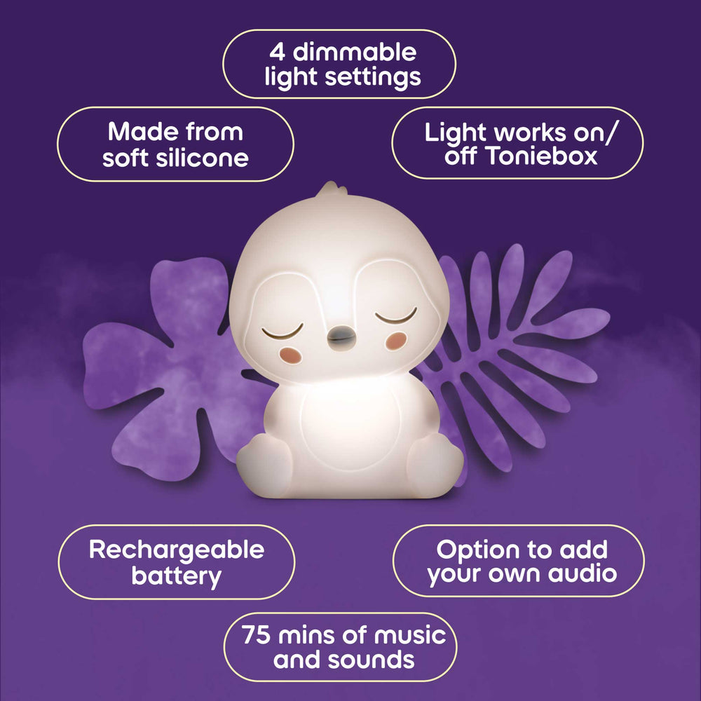 White silicone night light with purple leaves on a purple background, featuring text about its features.