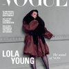 Vogue magazine cover featuring model Lola Young posing in a brown coat with a dark fur collar against a gray wall. Large white 'VOGUE' masthead and cover text are visible, with 'LOLA YOUNG' in bold at lower left.