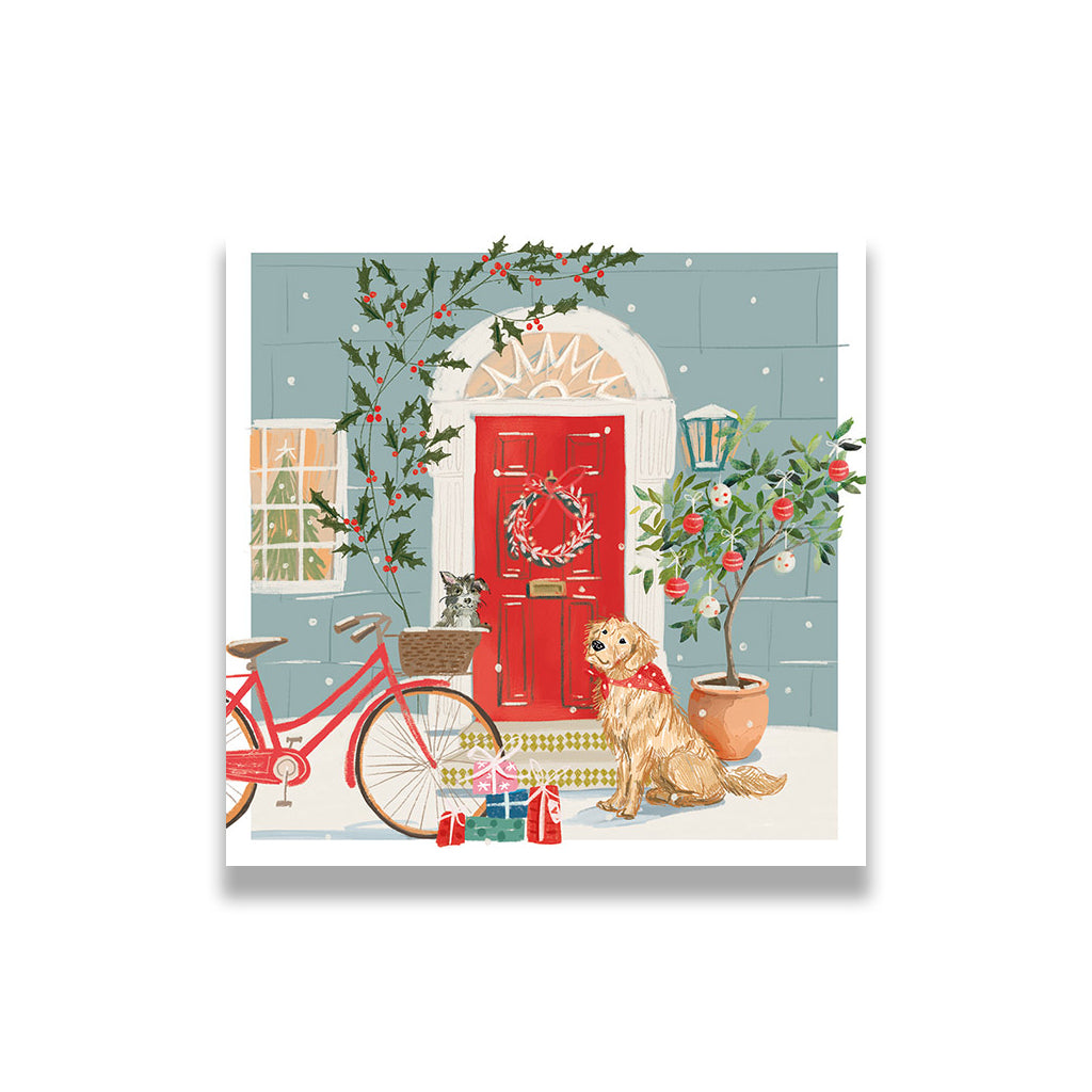 Christmas-themed illustration with a red door, bicycle, dog, and cat on a snowy street.