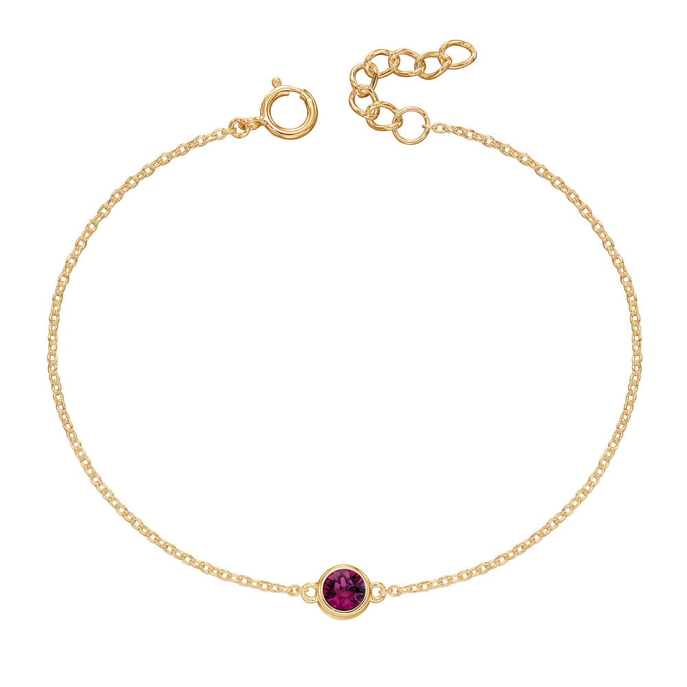 Gold bracelet with crystal birthstone for February.
