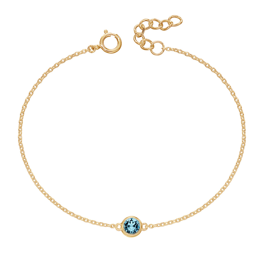 Gold bracelet with crystal birthstone for March.