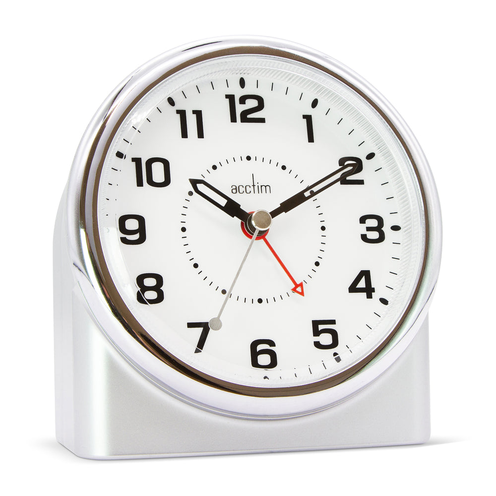 Silver alarm clock with black numbers and red second hand on a white background