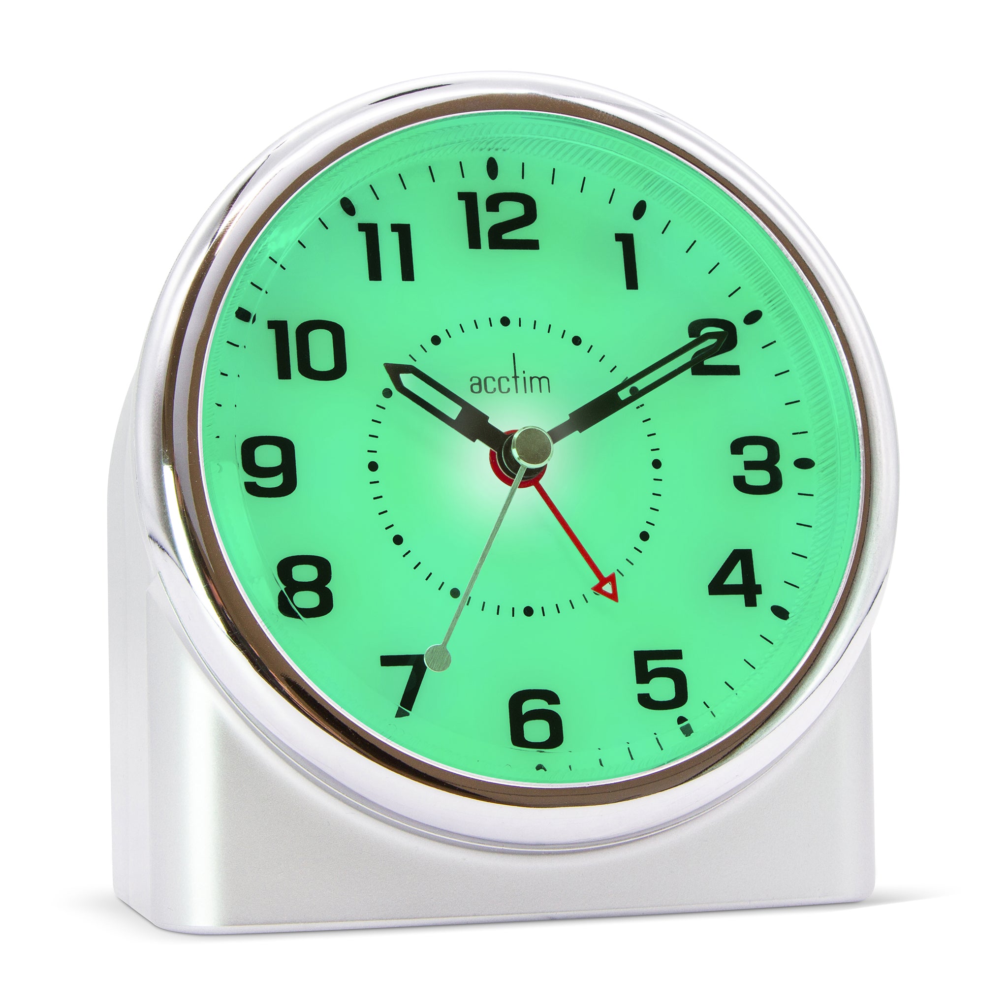 Silver alarm clock with green glowing face on a white background