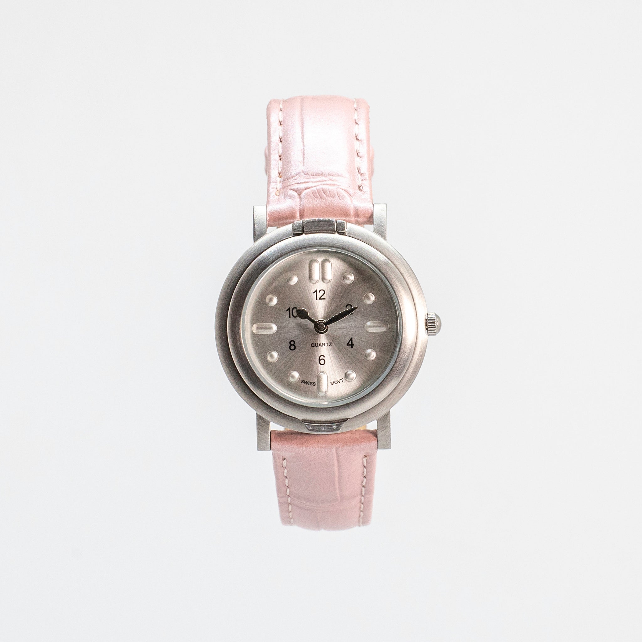 Front view of tactile watch with strap buckled up against a white background