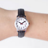 Someone wearing the watch with dark brown leather strap