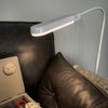 Sewing box on a chair illuminated by floor lamp