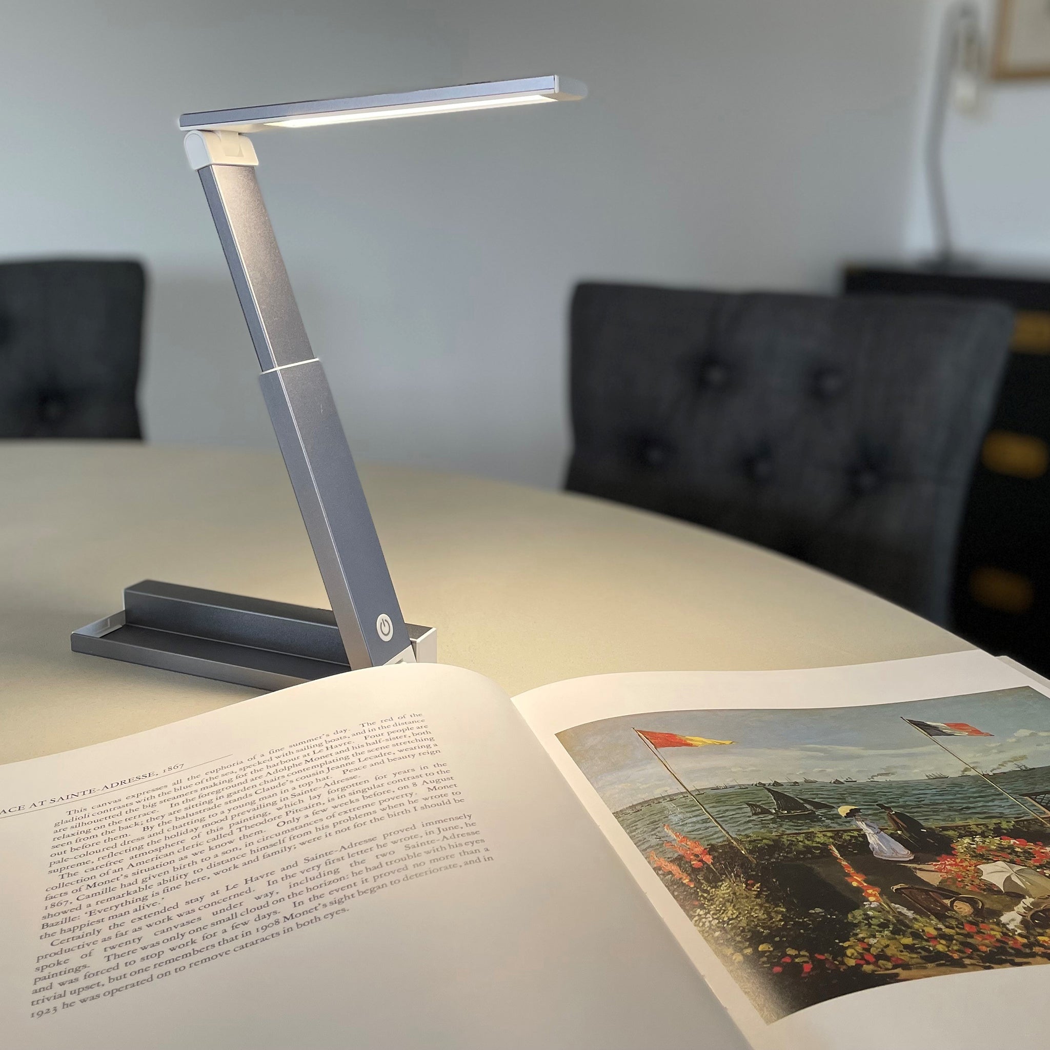 Light in use with an illustrated book on a table