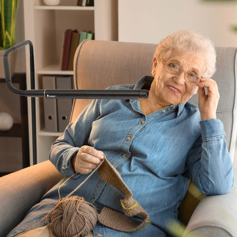 Woman using the light while knitting