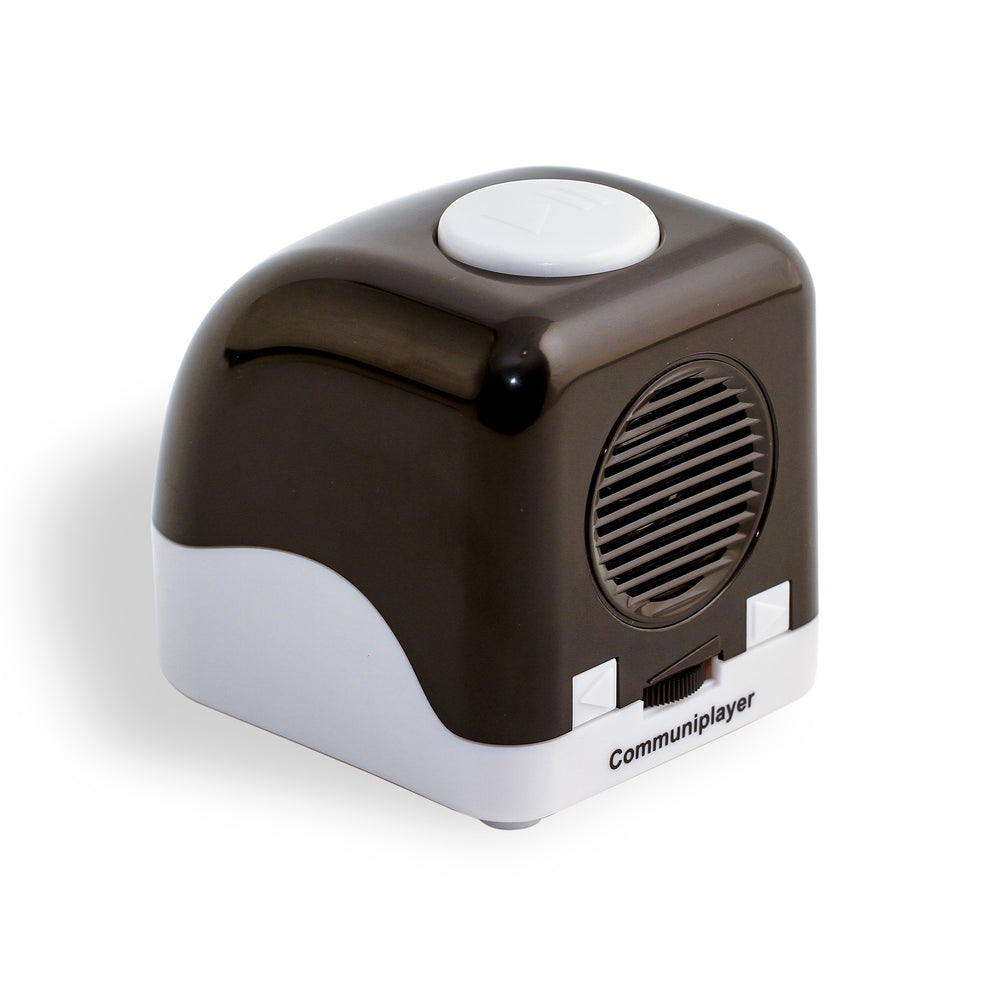 RNIB Communiplayer viewed at a front angle showing the top white button contrasting against the black and white casing. Also shown are the speaker gill and controls.