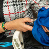 Person holding a blue jacket using the IKONN controller with colour sensor attached.