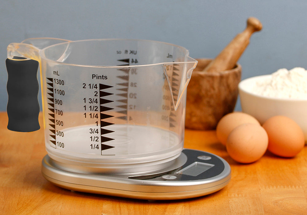 Talking scale with easy-to-see jug on a worktop with eggs, flour and a mortar and pestle