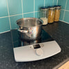 RNIB Talking induction hob on a kitchen worktop with a stainless steel pan on it.