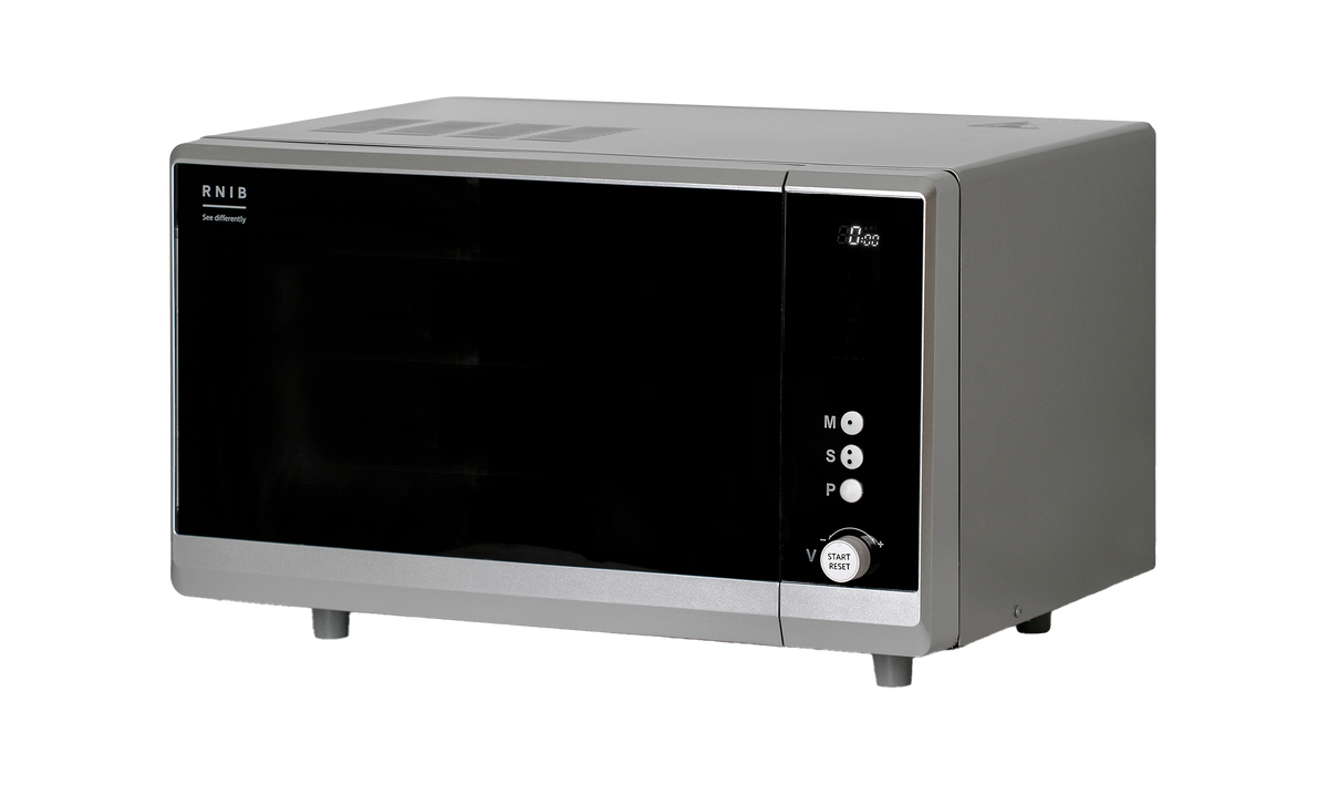 Silver microwave on a black background
