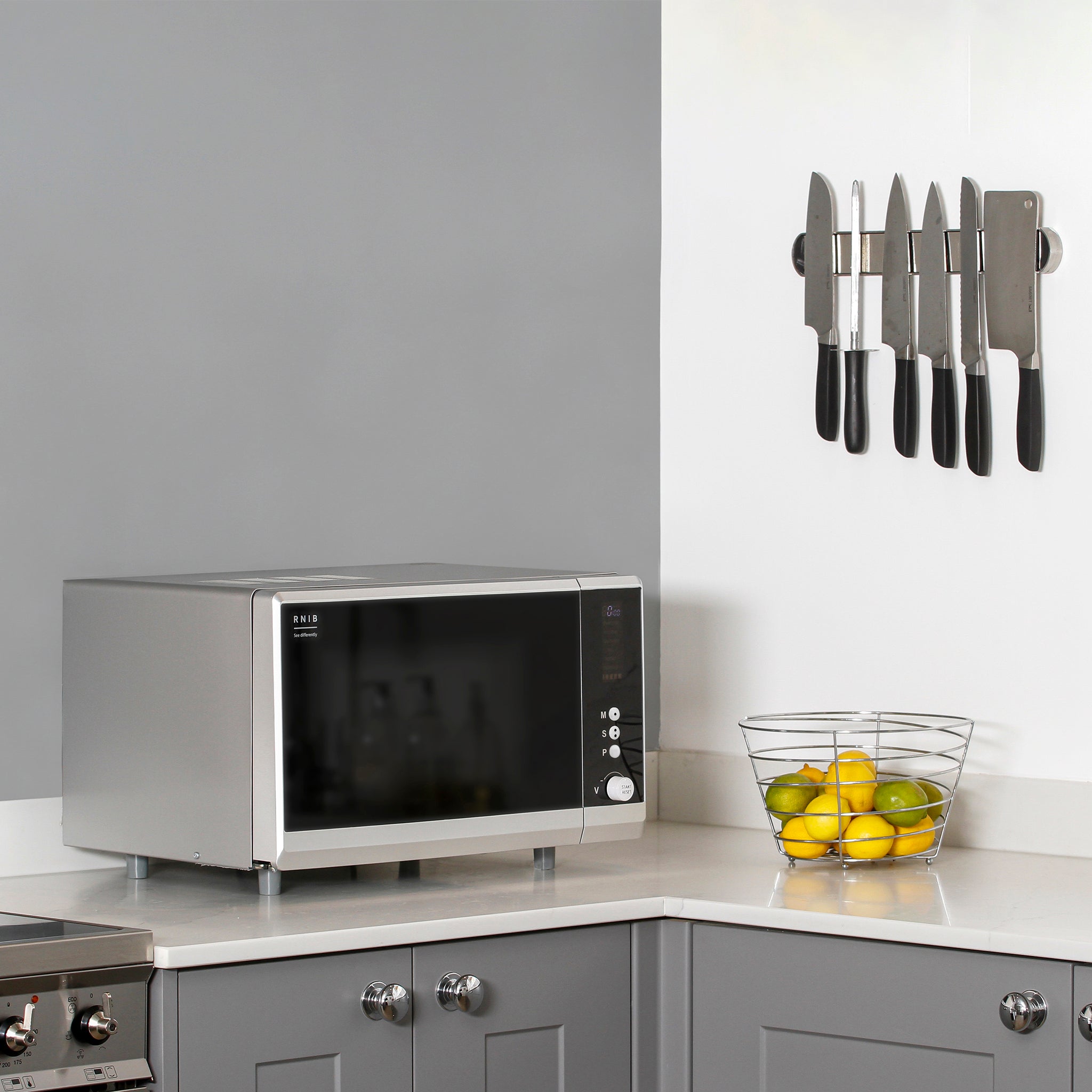 The RNIB talking microwave microwave on a counter top in a kitchen setting.
