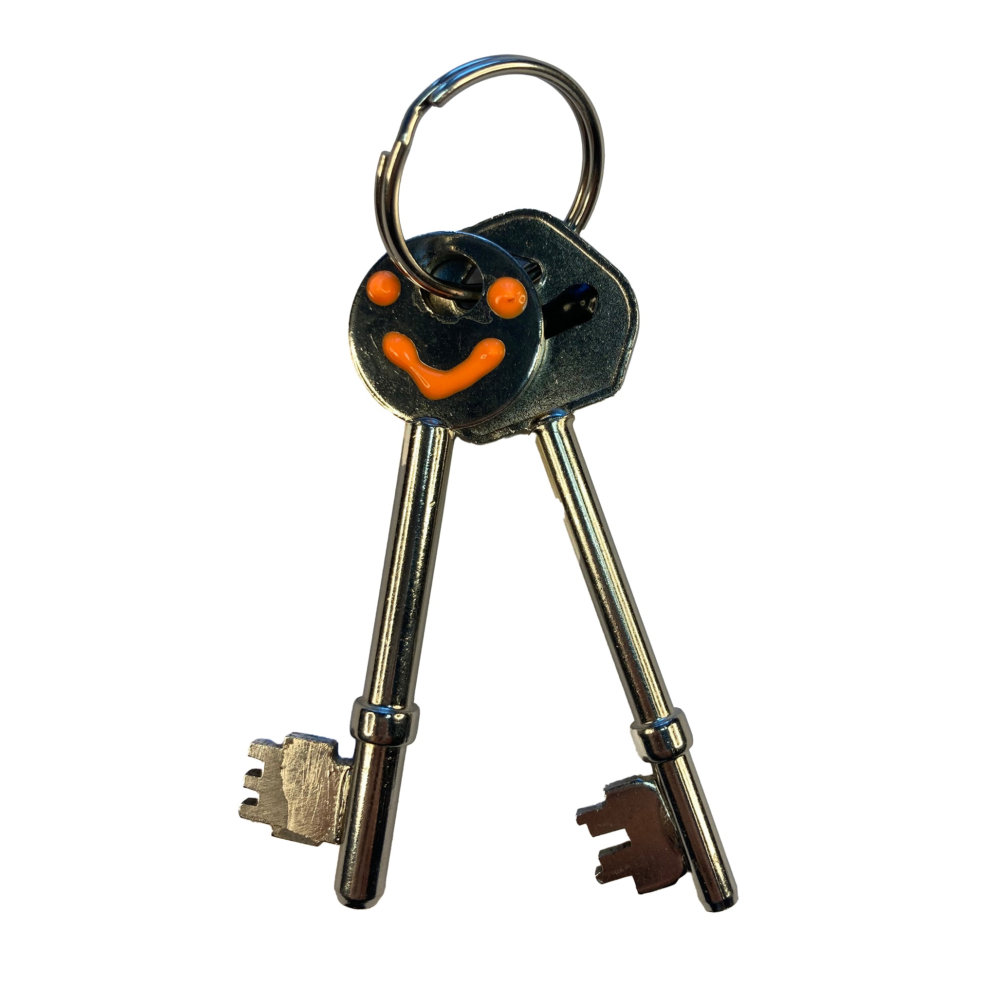Housekeys marked with black and orange tacti-mark