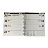 An open spiral-bound planner showing the weekly layout for May 2026, with days Monday through Sunday listed on white pages against a black header strip.