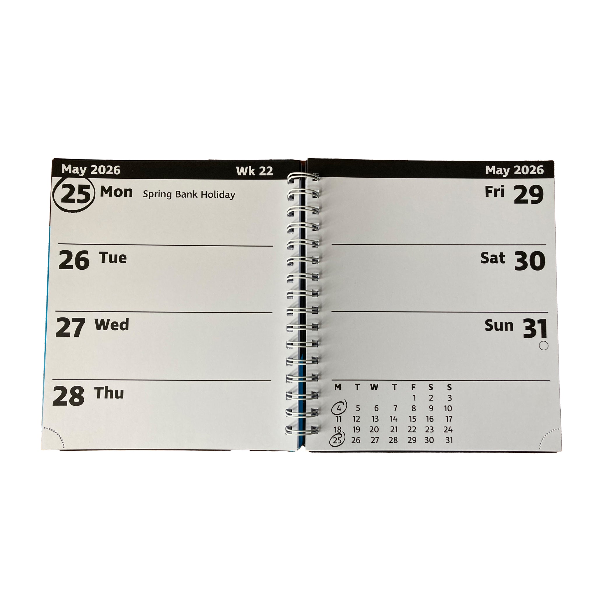An open spiral-bound planner showing the weekly layout for May 2026, with days Monday through Sunday listed on white pages against a black header strip.