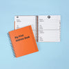 Two address books, one open showing page layout and the other closed showing the cover