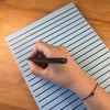 Someone writing in notepad
