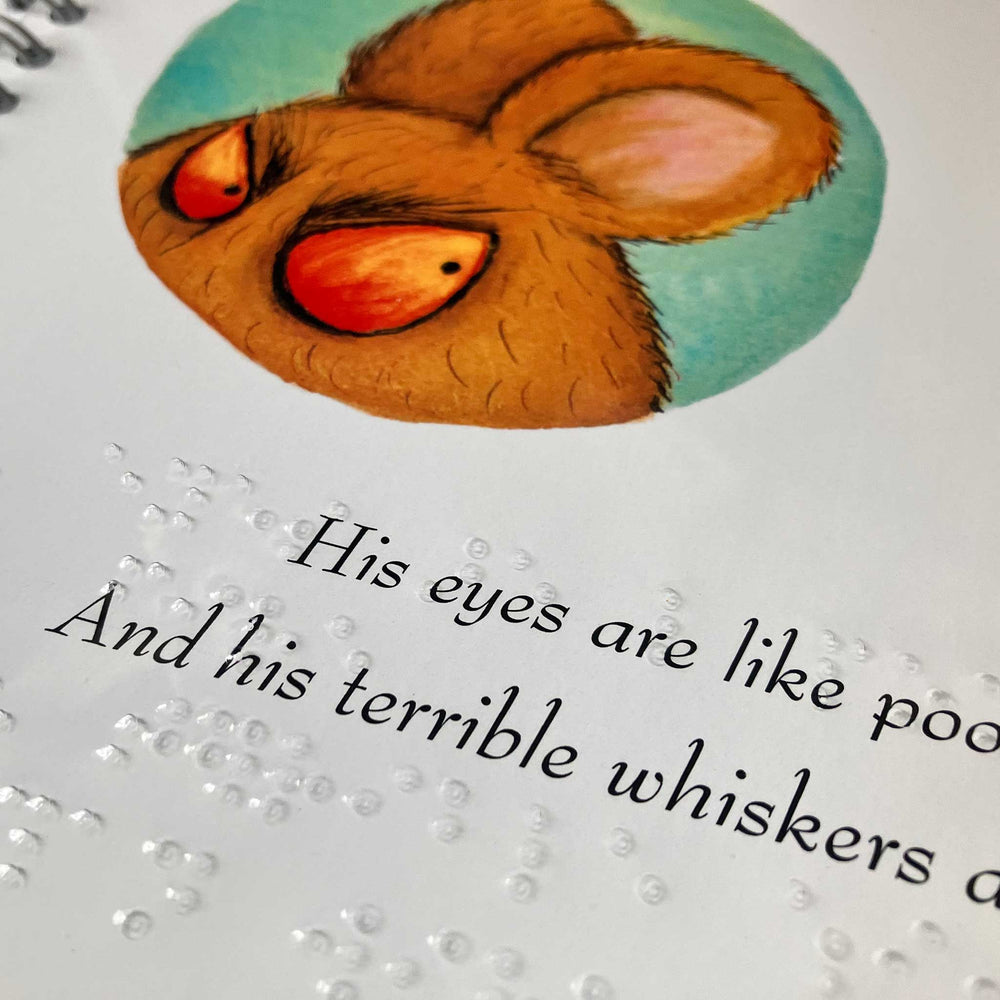 Page of The Gruffalo's Child showing illustration of the Big Bad Mouse along with the print, all overlaid with a clear brailled sheet