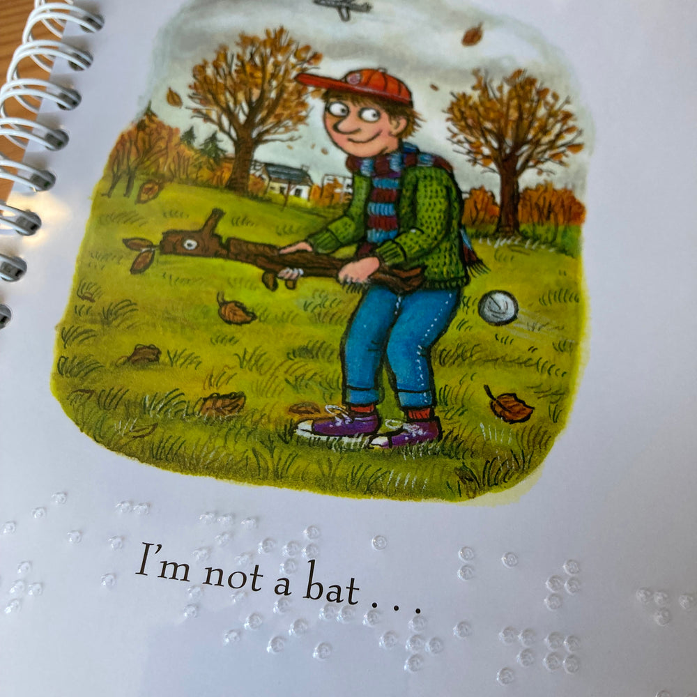 Illustration of a child using Stick Man as a bat, with text 'I'm not a bat...' and clear braille overlay