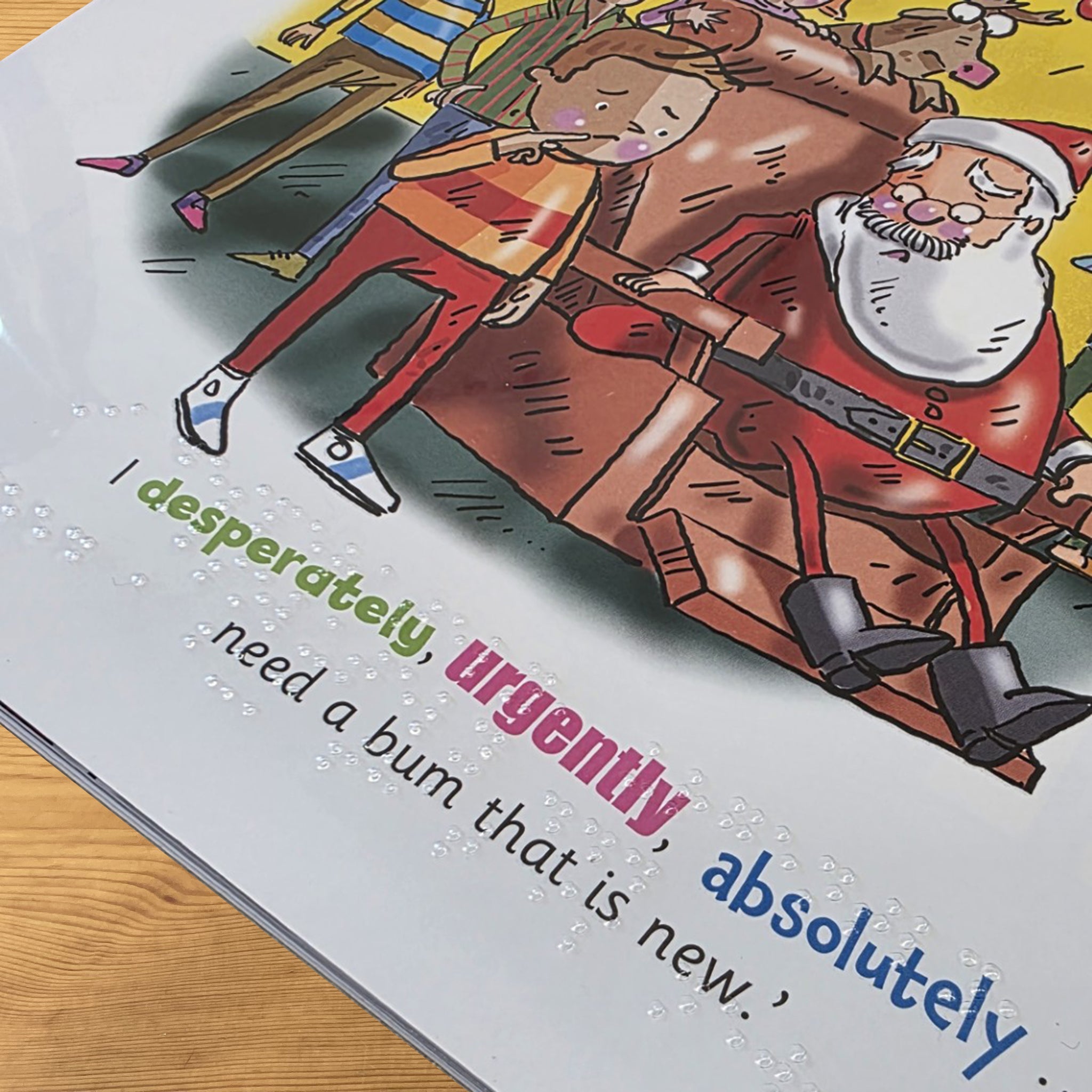 Close-up of clear braille overlay and the text and illustration underneath.