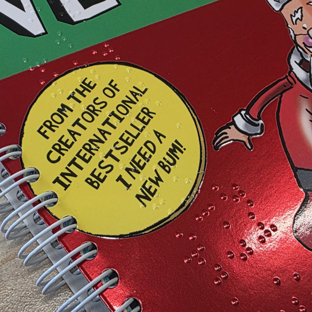 Close-up of braille on the cover of Santa needs a new bum!