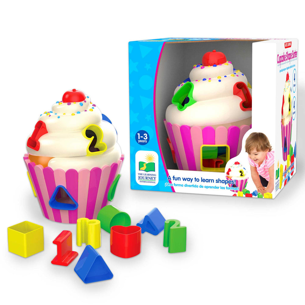 Colorful cupcake-shaped toy with building blocks and packaging on a white background