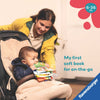 A baby sits in a stroller while a woman leans over and reads a colorful soft book to the baby. The image includes text reading 'My first soft book for on-the-go' and a badge that says '6-36 m', with a Ravensburger logo in the corner.