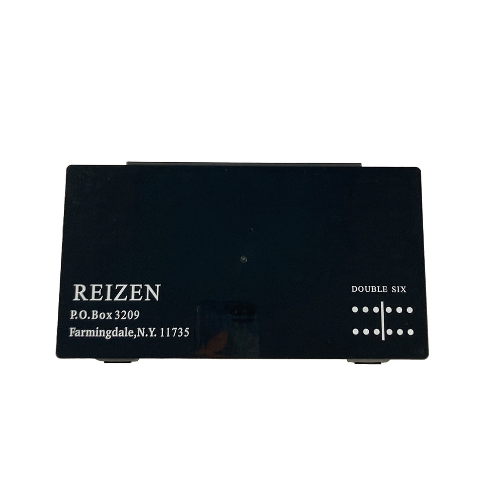 Black plstic case for storing dominos when not in use.