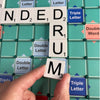 Someone placing a tile on the Scrabble board