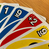 Close up of braille on fan of Uno cards