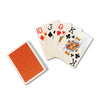 Four playing cards fanned out next to pack showing red backs