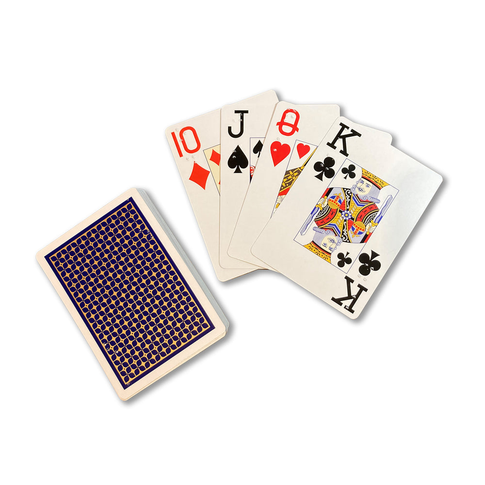Four playing cards fanned out next to pack showing blue backs