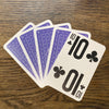 Large print playing cards fanned out showing the front of the 10 card and back of the blue pack.