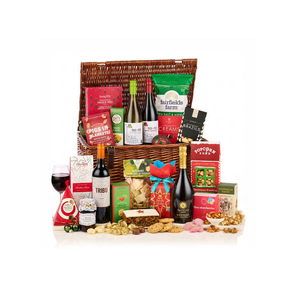 A large gourmet gift hamper filled with assorted food items, including wine bottles, packaged snacks, crackers, nuts, and chocolates, arranged in front of a white background.