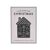 A gingerbread house cookie cutter set packaging card featuring a black line art illustration of a decorated gingerbread house with the text 'I'LL BE HOME FOR CHRISTMAS' and 'GINGERBREAD HOUSE COOKIE CUTTER SET' on a white background.