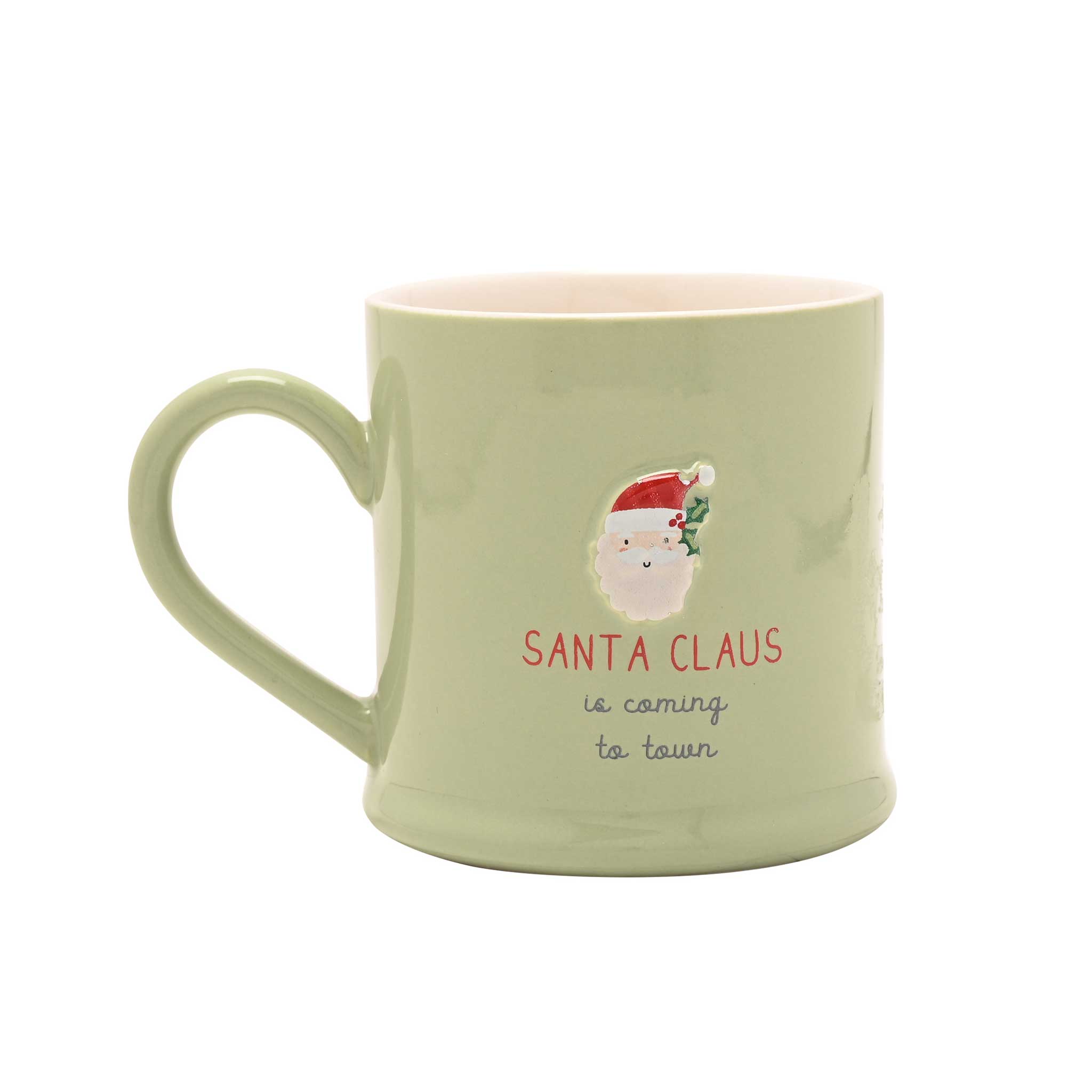 A light sage green ceramic mug with a handle, featuring a graphic of Santa Claus and the text 'SANTA CLAUS is coming to town' on a plain white background.