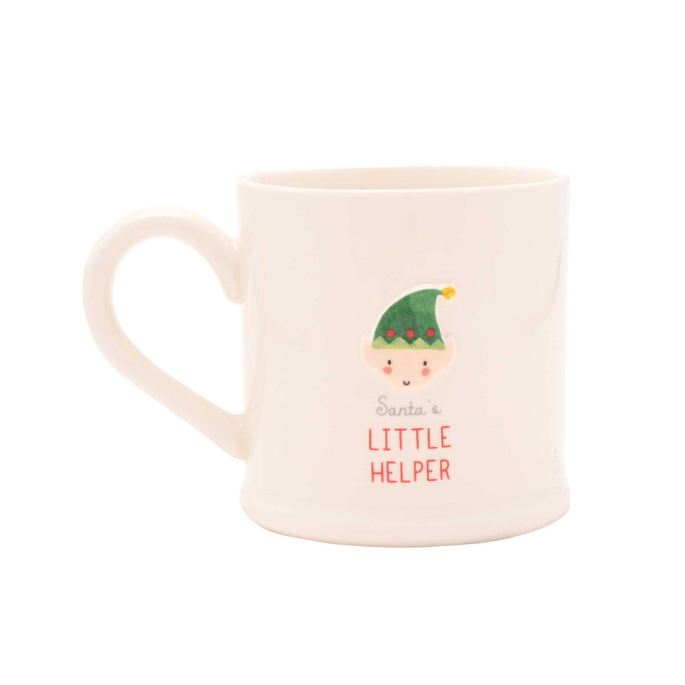 A white ceramic mug featuring a cute illustration of a Santa's Little Helper character and the text 'Santa's LITTLE HELPER' in red and black.