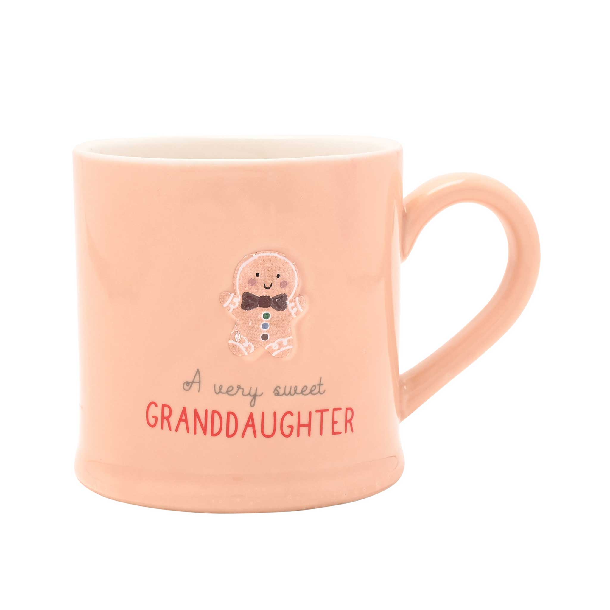 A light peach ceramic mug with a handle, featuring a cute gingerbread man illustration and the text 'A very sweet GRANDDAUGHTER' on a plain white background.