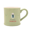A light sage green ceramic mug with a pink interior, featuring a snowman graphic and the text 'Wonderful GRANDSON' on the front.