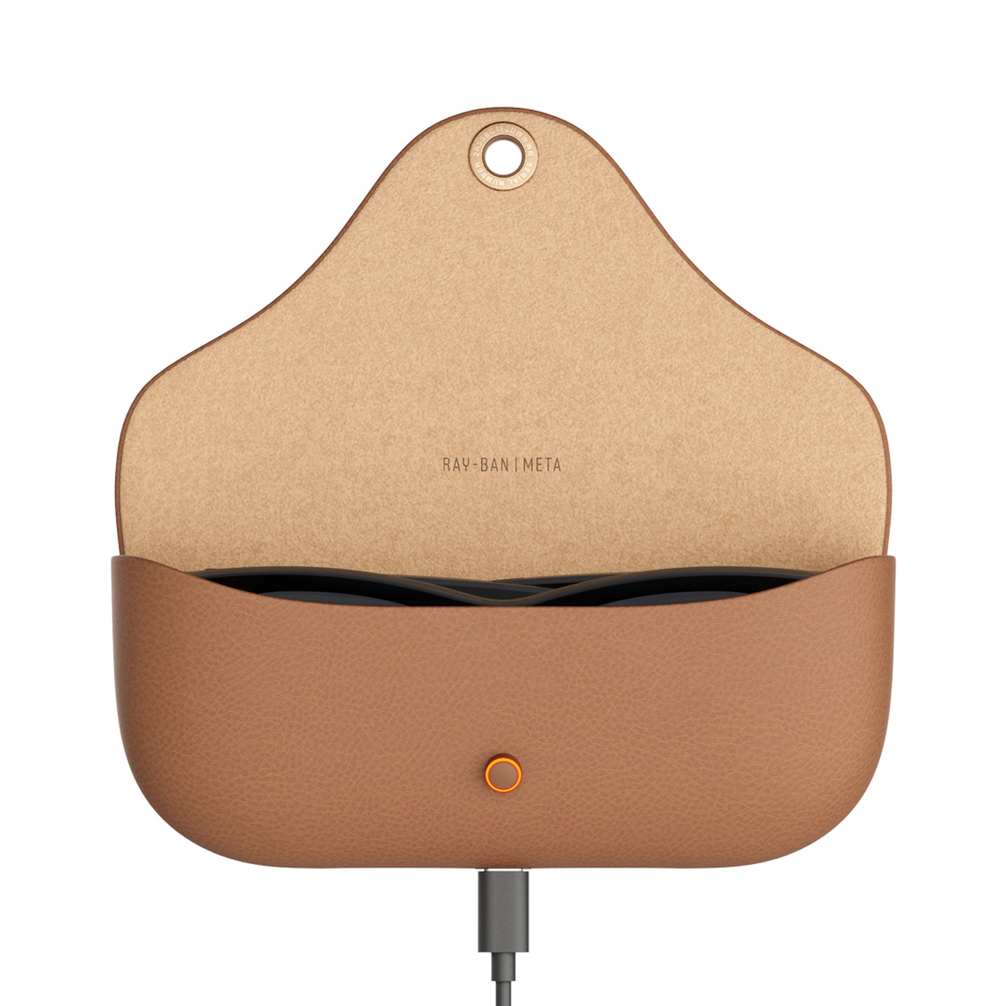 A tan leather charging case for Ray-Ban Meta earbuds, shown open with the earbuds inside and a charging cable plugged into the bottom port. The interior is a natural tan color with the brand name 'RAY-BAN META' printed on it.