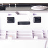 Close-up of radio control panel with two black directional buttons and a small black slider switch.