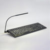 Keyboard (white text on black) with angled light turned on