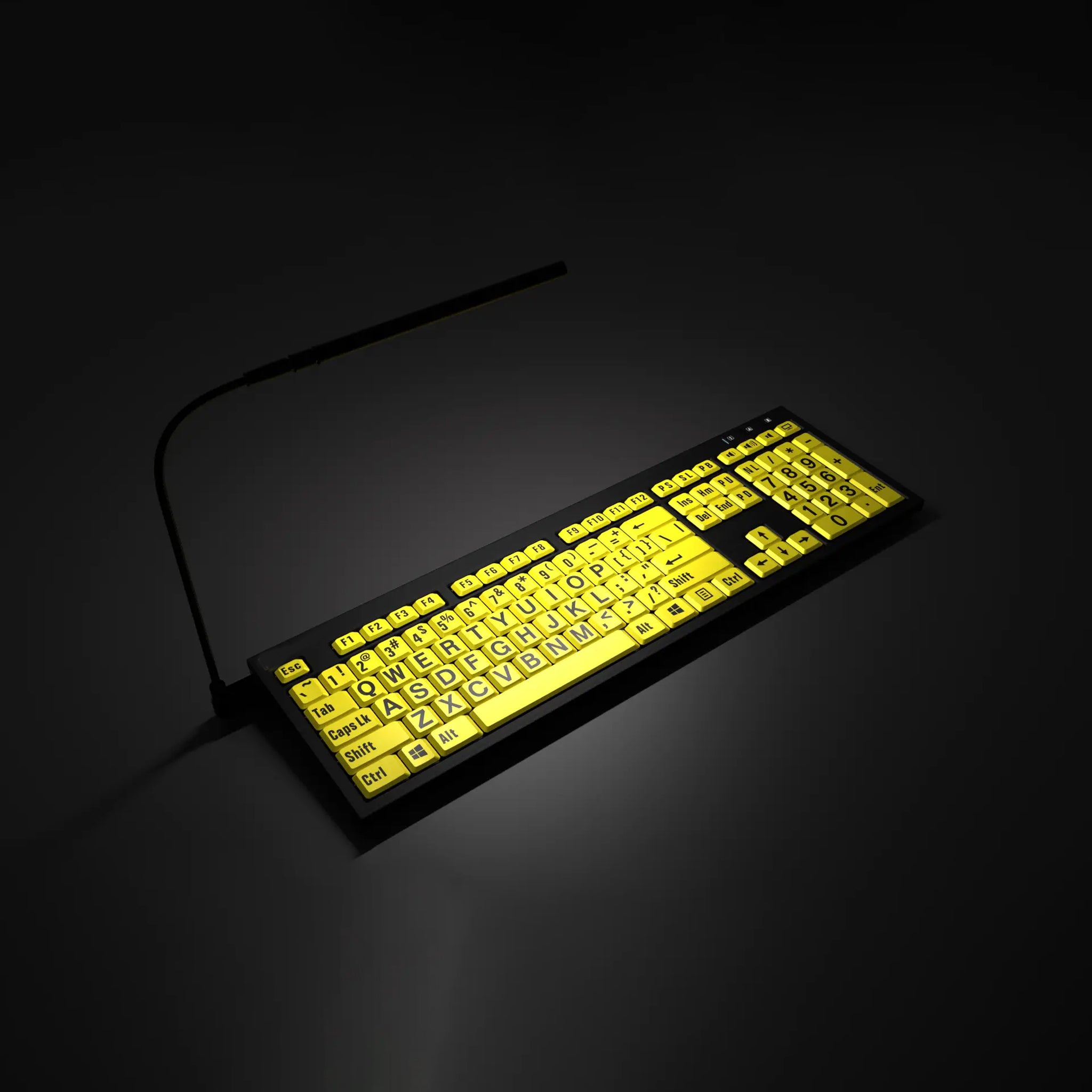 Keyboard (black text on yellow keys) with angled light turned on in a black area