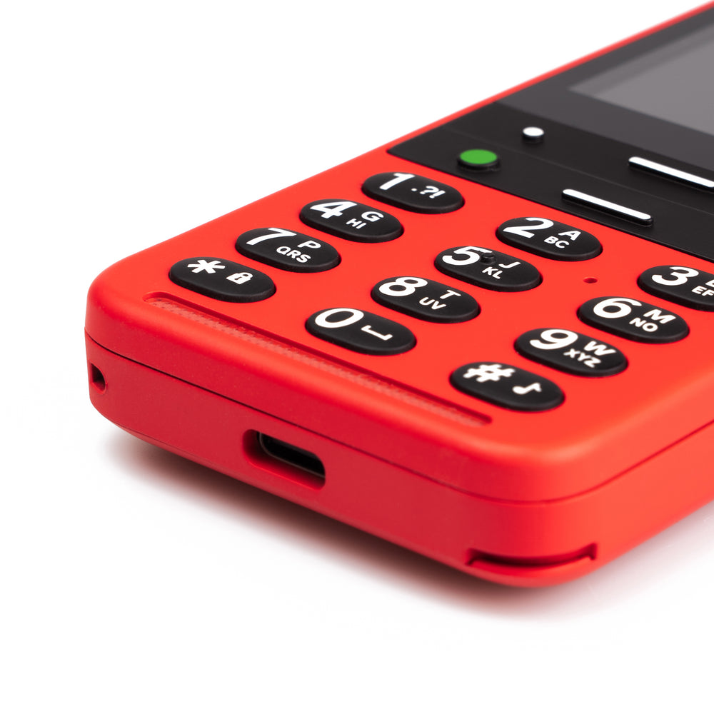 Close-up of keypad on red BlindShell Classic 2