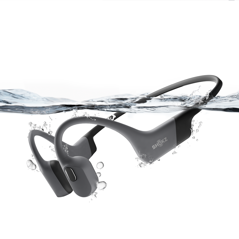 Side view of OpenSwim Shokz grey in water.
