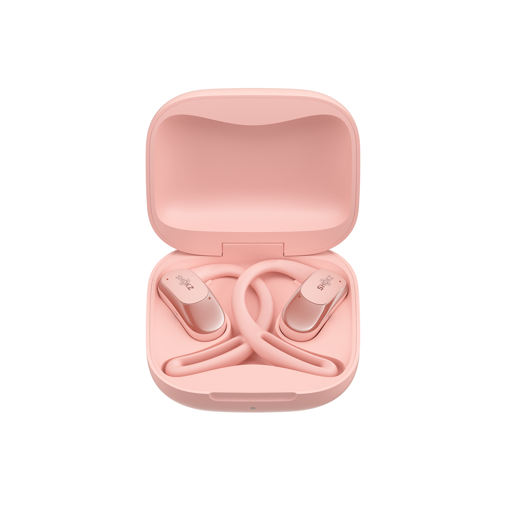OpenFit AIR Shokz in pink in a case against a white background.